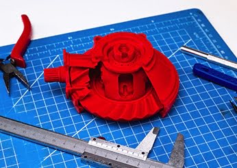 Red 3D print Part on Blue Cutting board with vernier